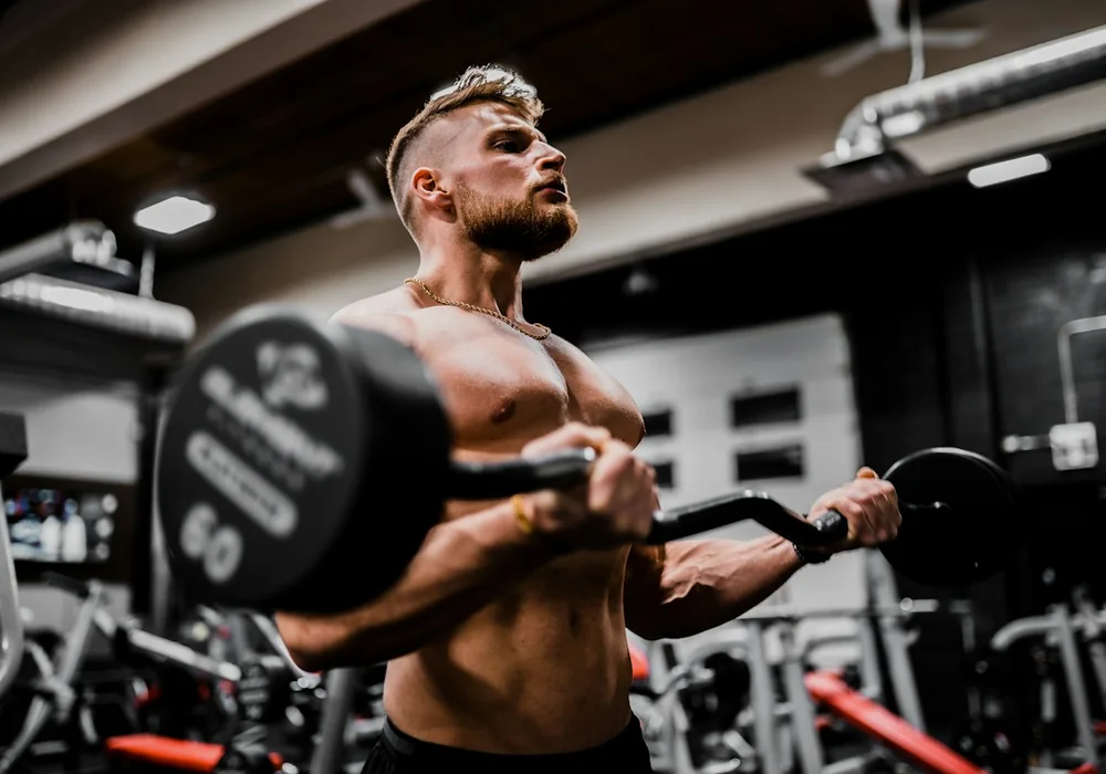 Heavy dumbbell rack and training area at Buraq Fitness Gym